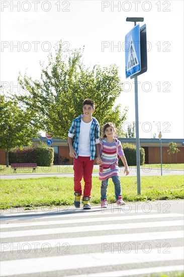 Children crossing a zebra crossing