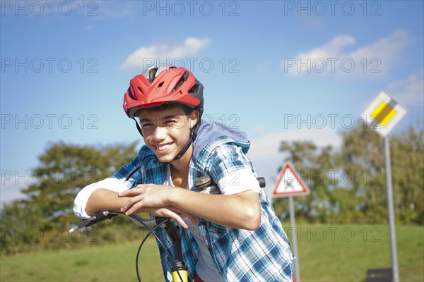 Boy wearing a bike helmet at a traffic awareness course