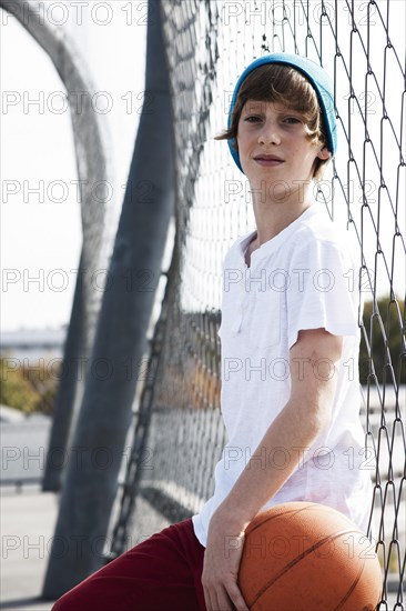 Cool boy holding a basketball