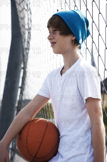 Cool boy holding a basketball