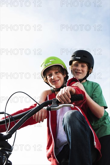 Two cool boys on a BMX bike