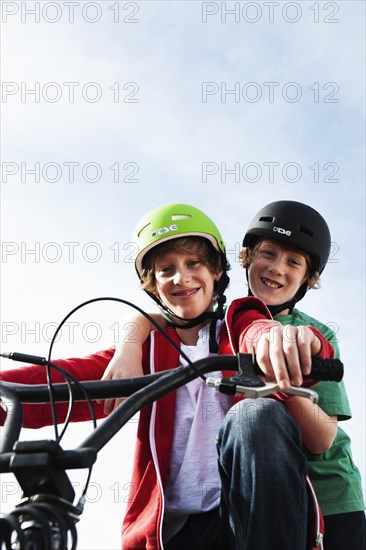 Two cool boys on a BMX bike