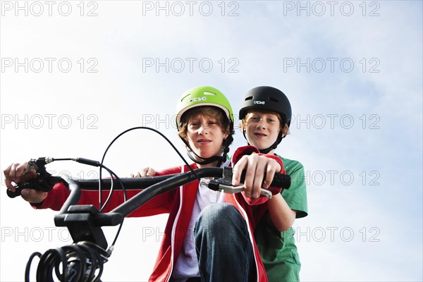 Two cool boys on a BMX bike