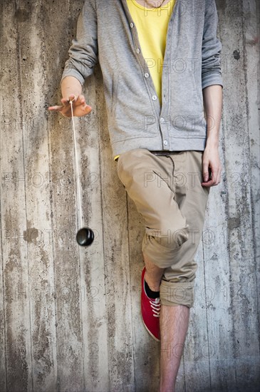 Young man playing with a yo-yo