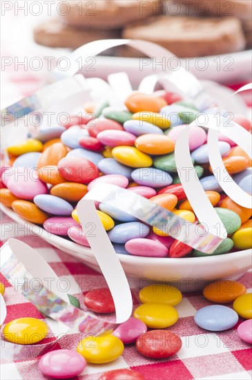 Multicolored candy with paper streamer