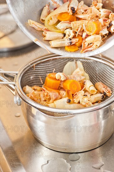 Sifting boiled prawns