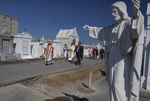 Archbishop Gregory Aymond leads the Blessing of the Graves at St. Louis #3 Cemetery on All Saints Day