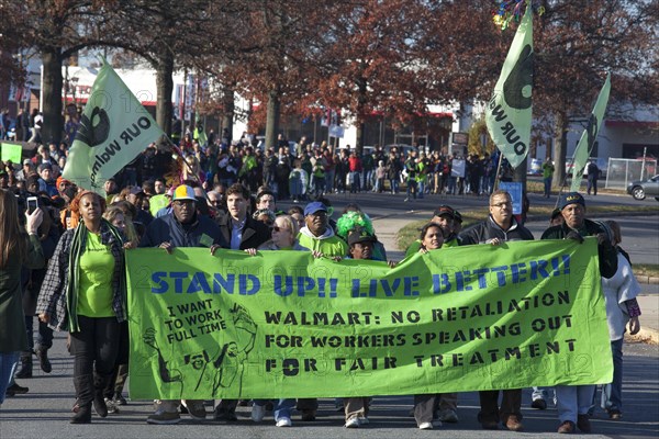 Walmart workers rally with supporters outside one of the company's stores on Black Friday