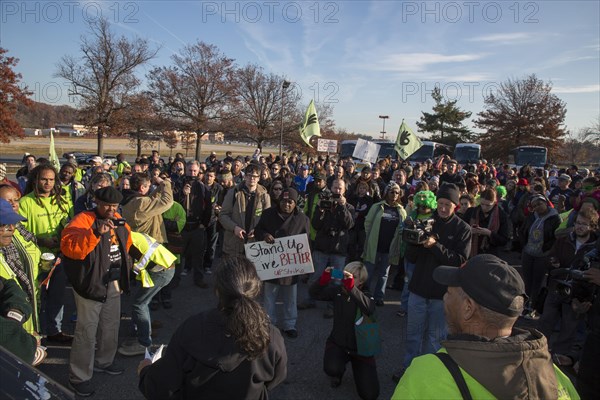 Walmart workers rally with supporters outside one of the company's stores on Black Friday