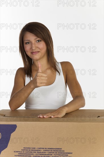 Young woman with a moving box