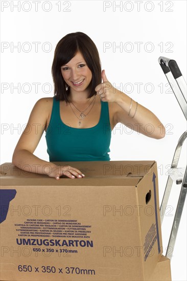 Young woman with moving boxes