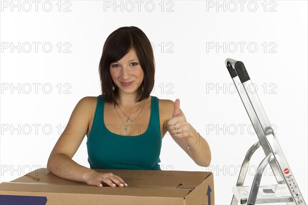 Young woman with a moving box