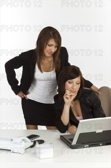 Two young women in an office