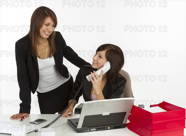 Two young women in an office