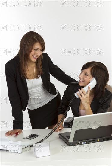 Two young women in an office