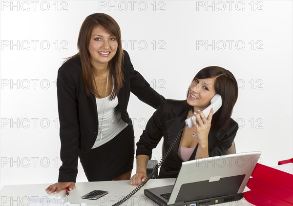 Two young women in an office