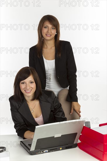 Two young women in an office