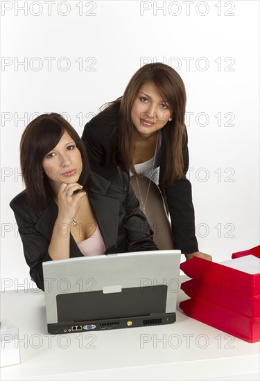 Two young women in an office