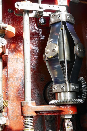 View into the open housing of a mechanical centrifugal governor for limiting the speed