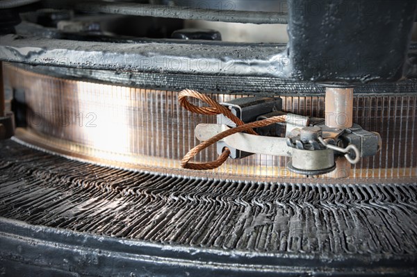 Close-up of the carbon brushes and the collector of an alternator