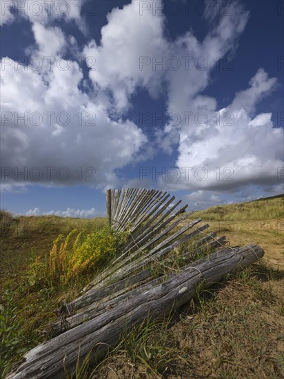 Damaged dune protection fence in the Bay of Douarnenez