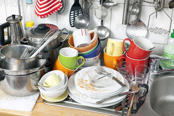 Pile of dishes in a kitchen