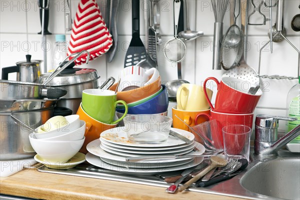 Pile of dishes in a kitchen