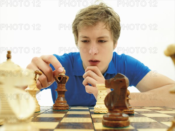 Young man playing chess