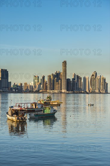 Little fishing boats before the skyline of Panama City