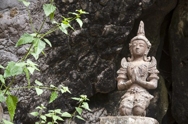 Statue or sculpture in front of the Buddha Cave