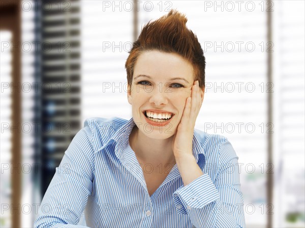 Businesswoman with a punk hairstyle in an office