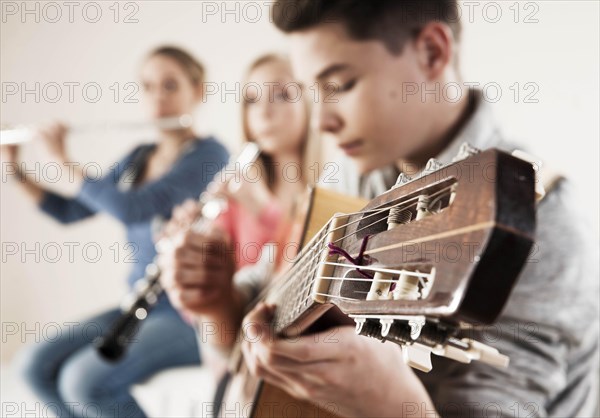 Teenagers making music together