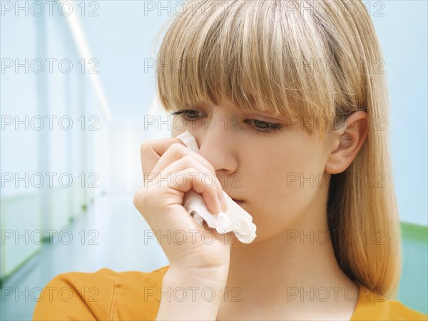 Young woman holding a tissue