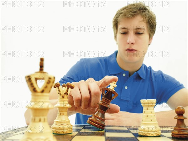 Young man playing chess