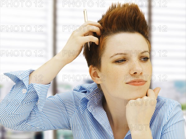 Businesswoman with a punk hairstyle in an office