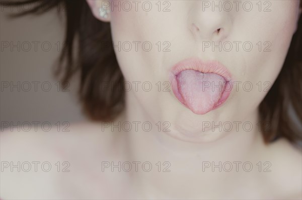 Woman sticking out her tongue