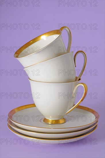 Antique coffee cups with a gold rim
