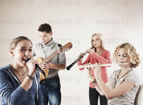 Teenagers making music together