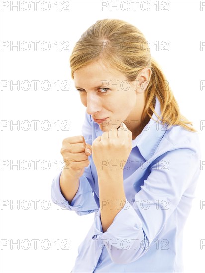 Pugnacious young woman with clenched fists