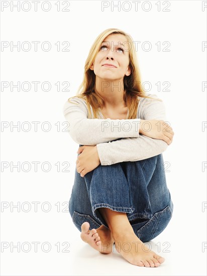 Woman sitting with bent knees