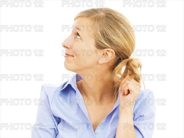 Young woman looking bashful