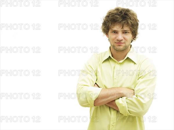 Young man with his arms crossed