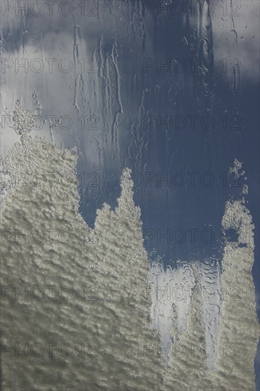 Roof of a conservatory with melting snow