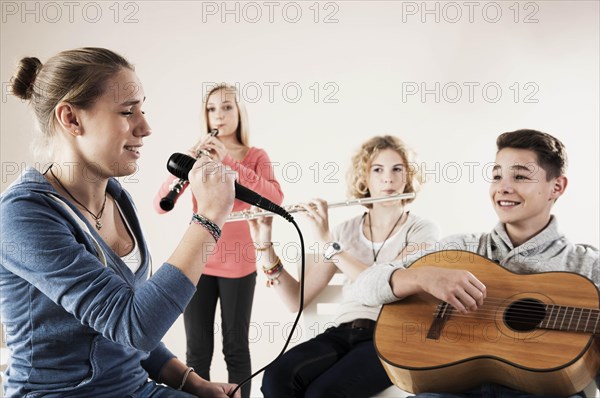 Teenagers making music together