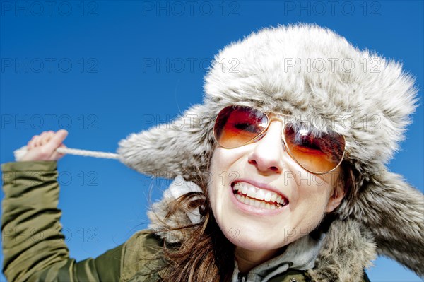 Happy woman wearing winter clothes