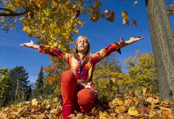 10-year-old girl enjoying the sunny autumn weather