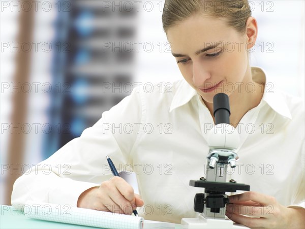 Scientist working with a microscope