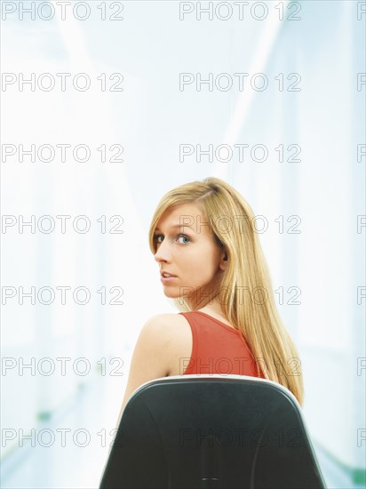 Young woman sitting on chair