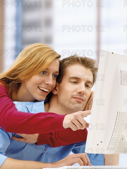 Young couple using a computer