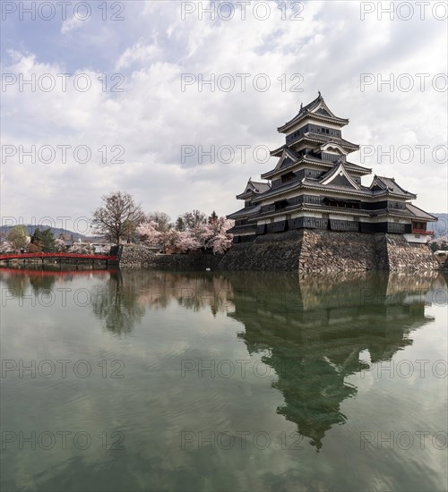 Old Japanese castle reflected in the moat